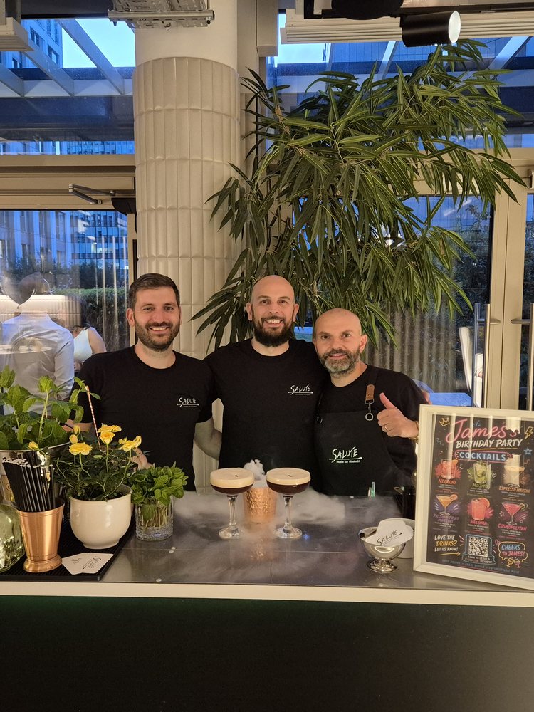 The Salute team of Italian bartenders behind the bar at an event